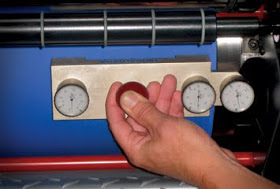 Measuring offset blanket height against bearer cylinder.